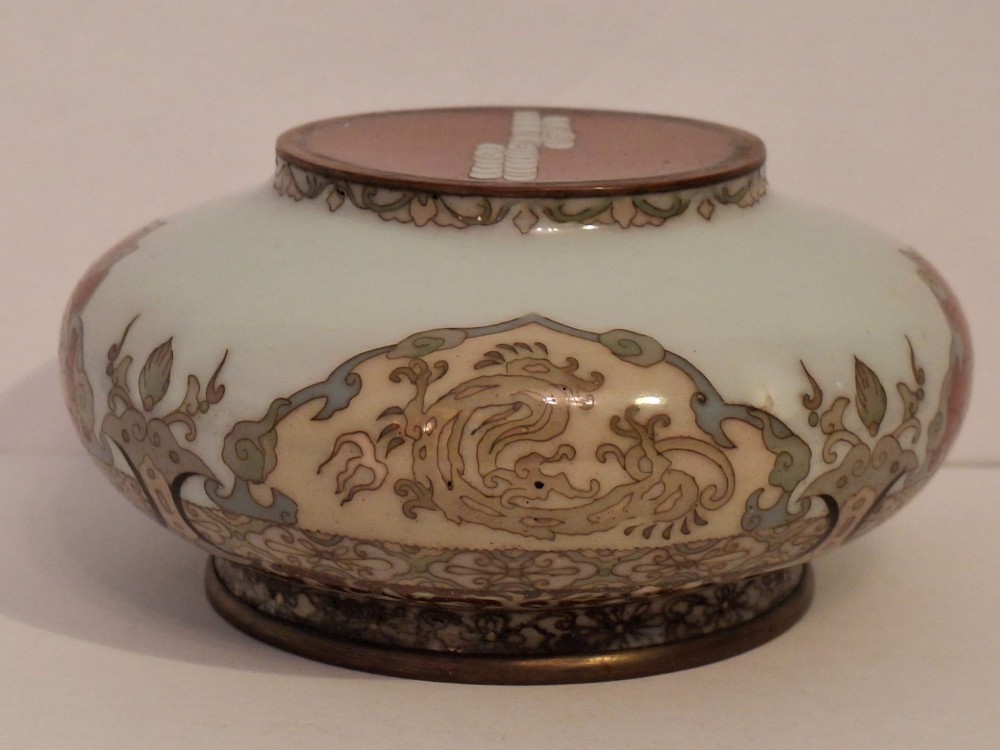 A Japanese cloisonne enamel koro decorated with phoenix motifs and intricate floral scrollwork, topped with a domed lid and carved finial. View XV