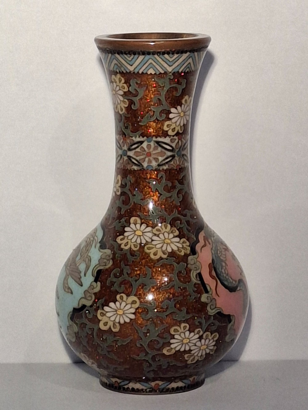 A pair of Japanese Meiji period cloisonne enamel miniature vases featuring detailed dragon and phoenix medallions on brown and light blue grounds. View VII