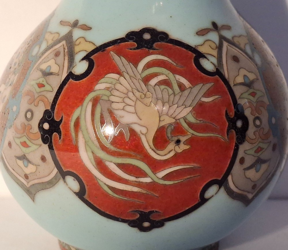A pair of Japanese Meiji period cloisonne enamel miniature vases featuring detailed dragon and phoenix medallions on brown and light blue grounds. View XI