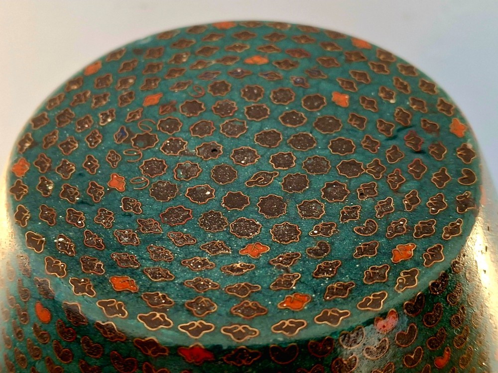 A pair of rounded Japanese cloisonne enamel ginger jars decorated with dense green foliage scrollwork and colourful floral motifs with domed lids. View XI