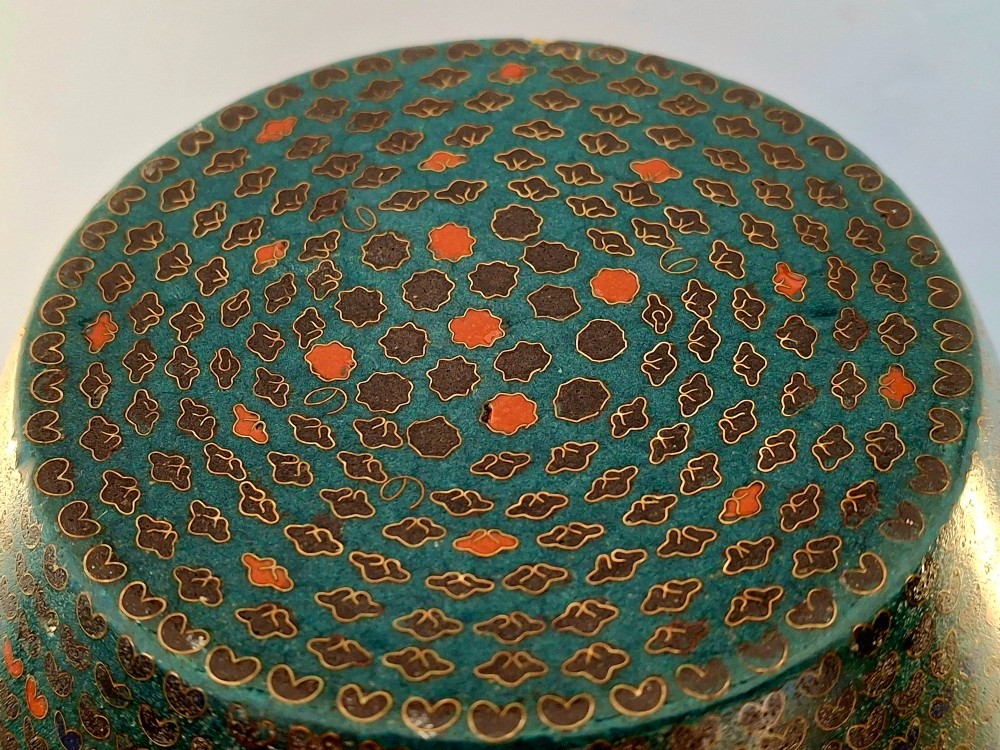 A pair of rounded Japanese cloisonne enamel ginger jars decorated with dense green foliage scrollwork and colourful floral motifs with domed lids. View XII