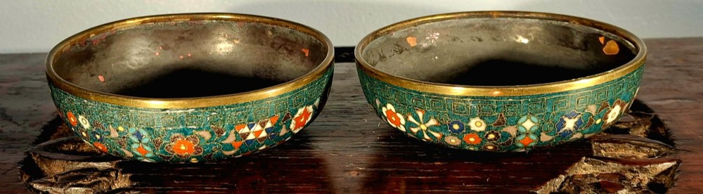 A pair of rounded Japanese cloisonne enamel ginger jars decorated with dense green foliage scrollwork and colourful floral motifs with domed lids. View XIII