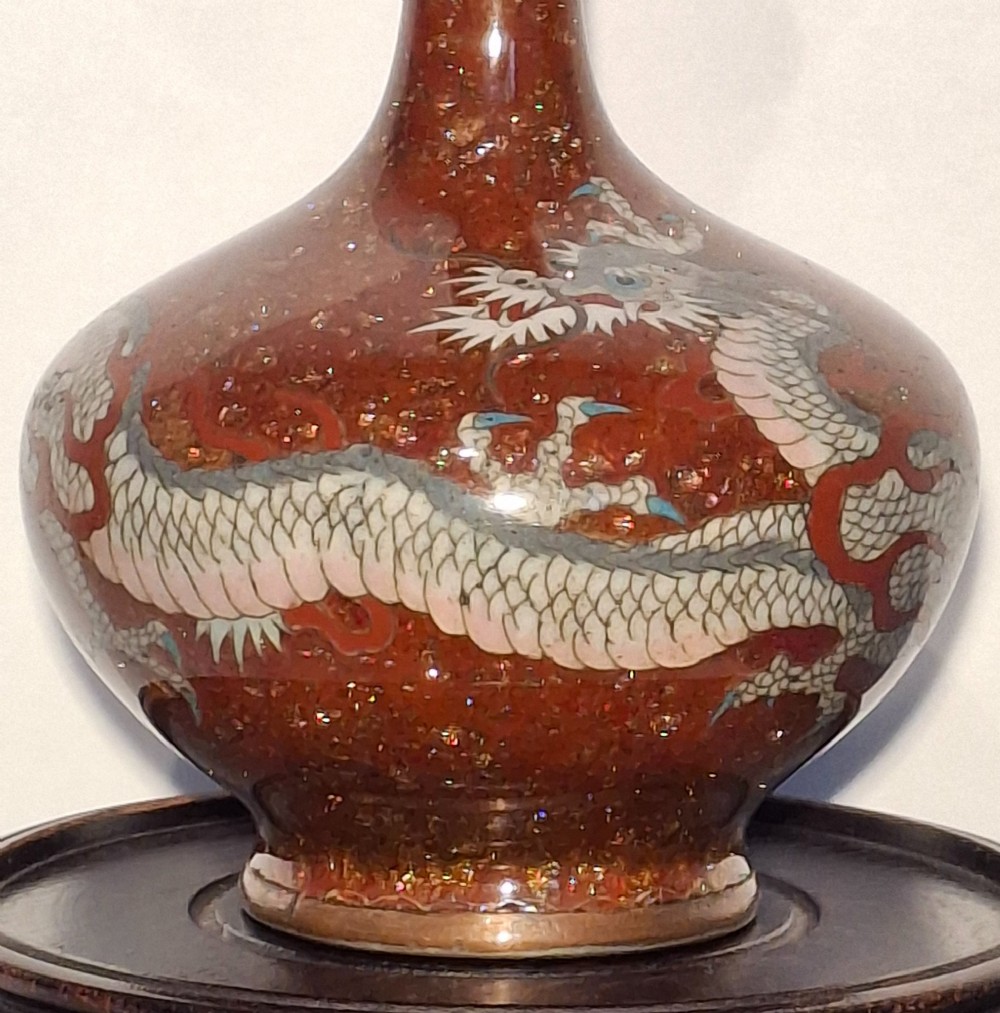 A miniature dark red Japanese cloisonne enamel vase featuring a detailed coiled dragon motif and a slender neck. View V