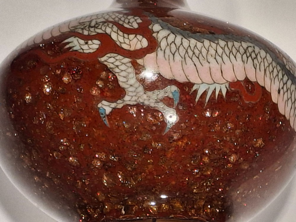 A miniature dark red Japanese cloisonne enamel vase featuring a detailed coiled dragon motif and a slender neck. View XII