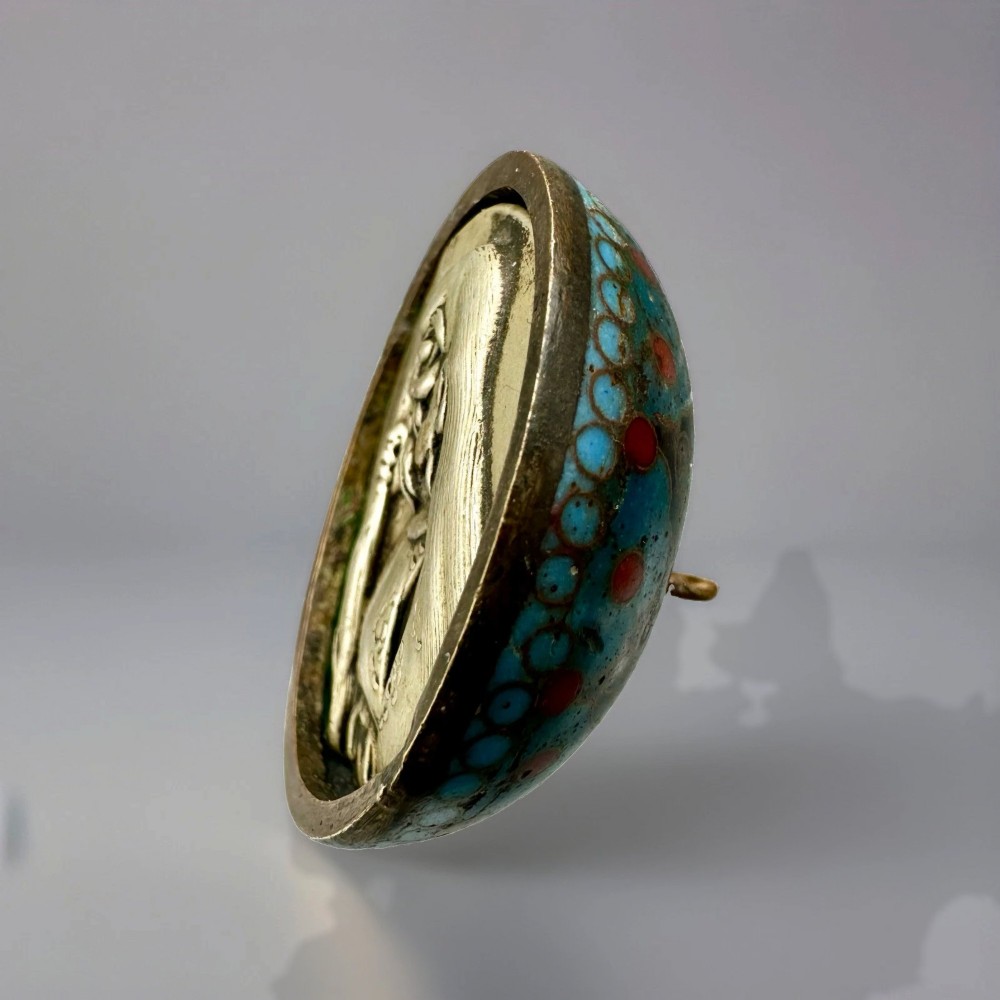 A domed Japanese cloisonne enamel ash receiver cover decorated with black scrollwork, turquoise patterned borders, red dots, and a brass top loop. View IV