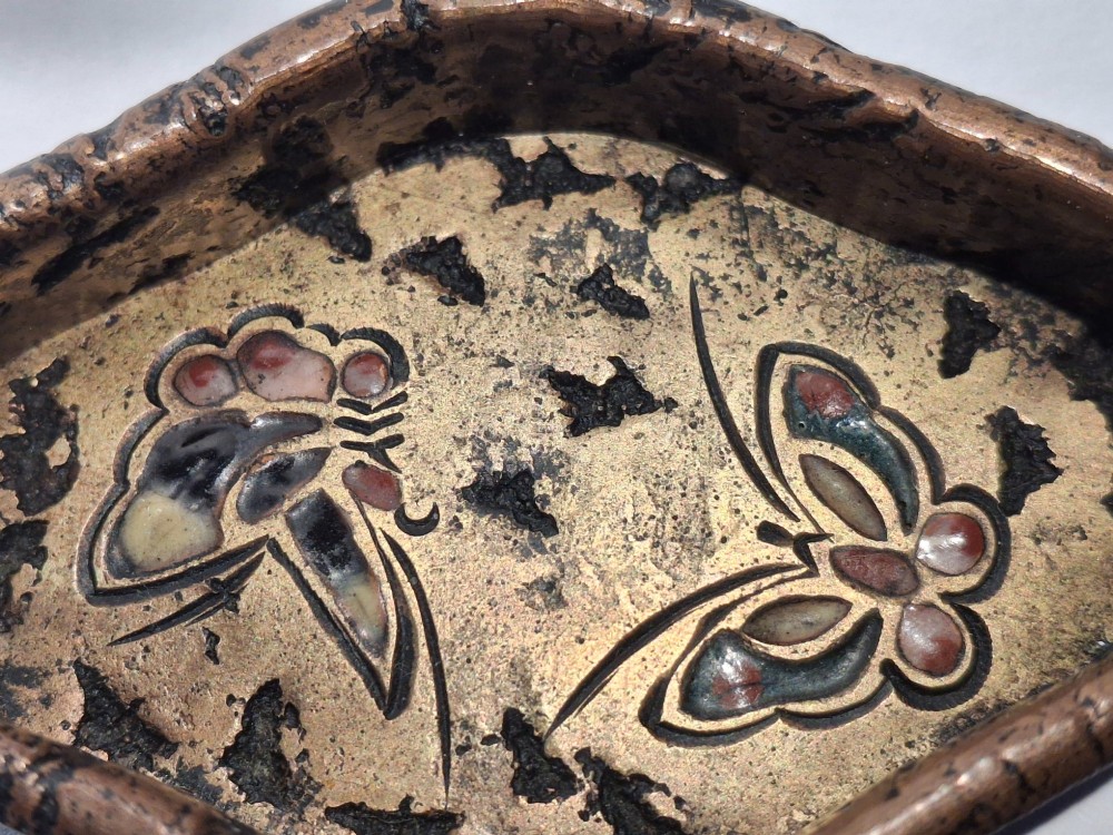 An oval-shaped antique Japanese bronze recessed door pull featuring two decorative enamel butterflies against a textured gilded background. View VII