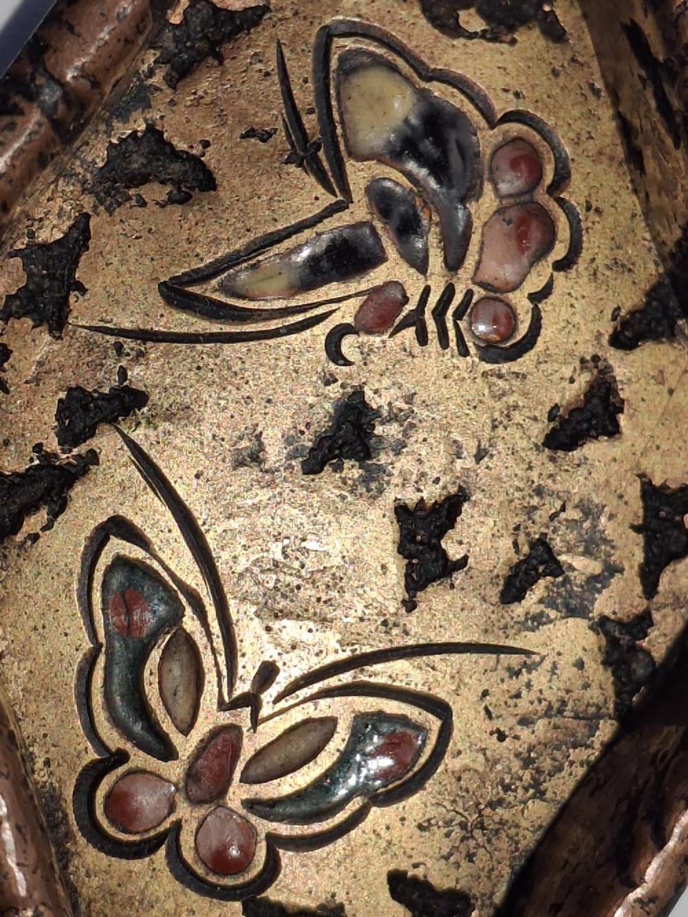 An oval-shaped antique Japanese bronze recessed door pull featuring two decorative enamel butterflies against a textured gilded background. View XIII
