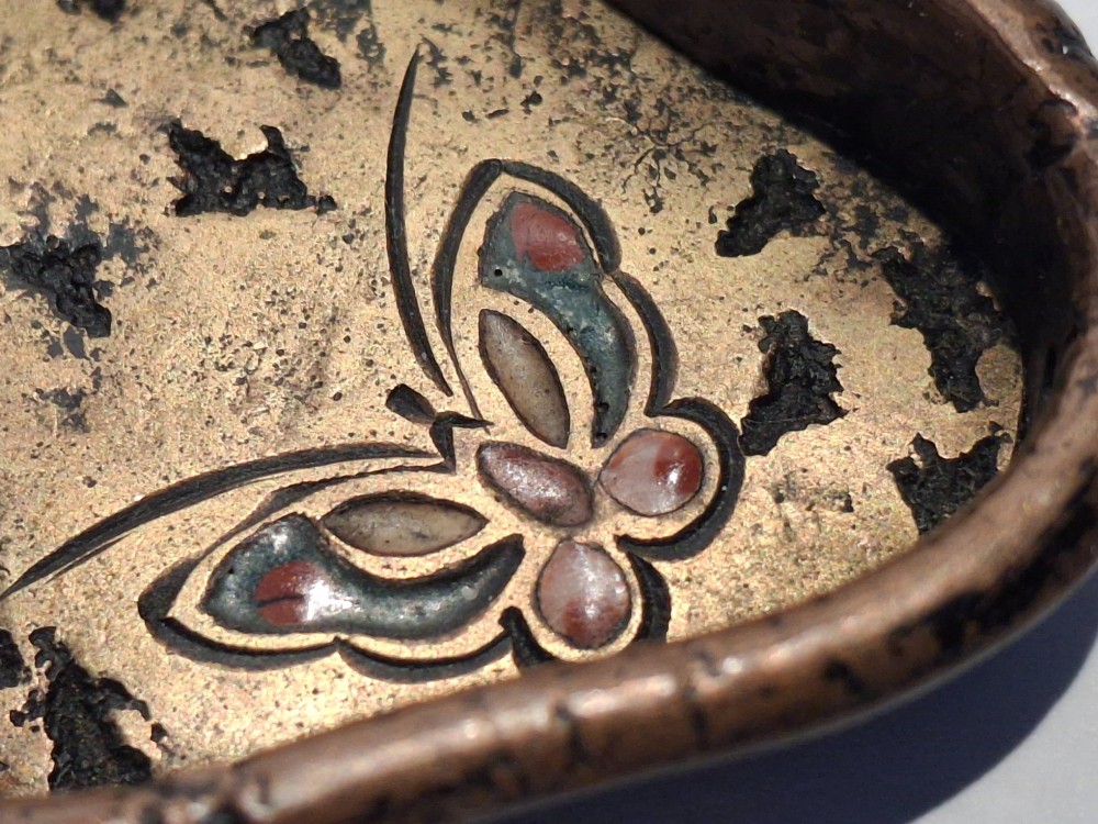 An oval-shaped antique Japanese bronze recessed door pull featuring two decorative enamel butterflies against a textured gilded background. View XIV