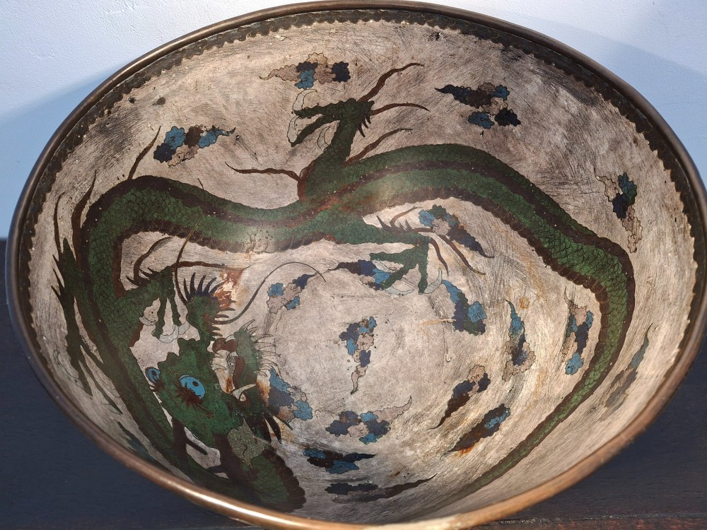 A large Japanese cloisonne enamel bowl featuring green dragon motifs, displayed on a carved dark wooden stand. View XI