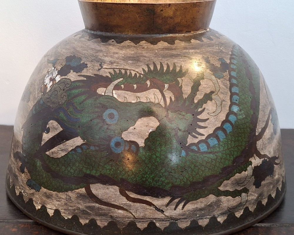 A large Japanese cloisonne enamel bowl featuring green dragon motifs, displayed on a carved dark wooden stand. View XIII