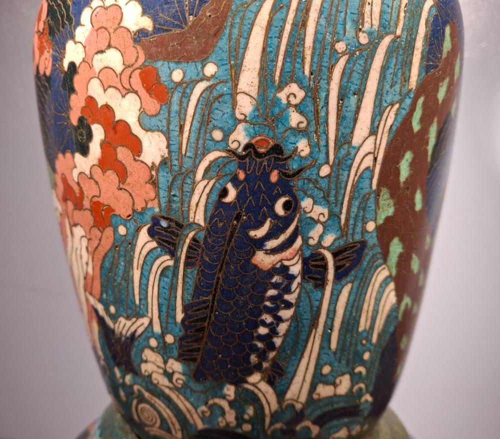 A large Japanese Meiji period cloisonne enamel vase with a wide flared top, decorated with a leaping koi carp motif amongst waterfalls and polychrome geometric patterns. View VII