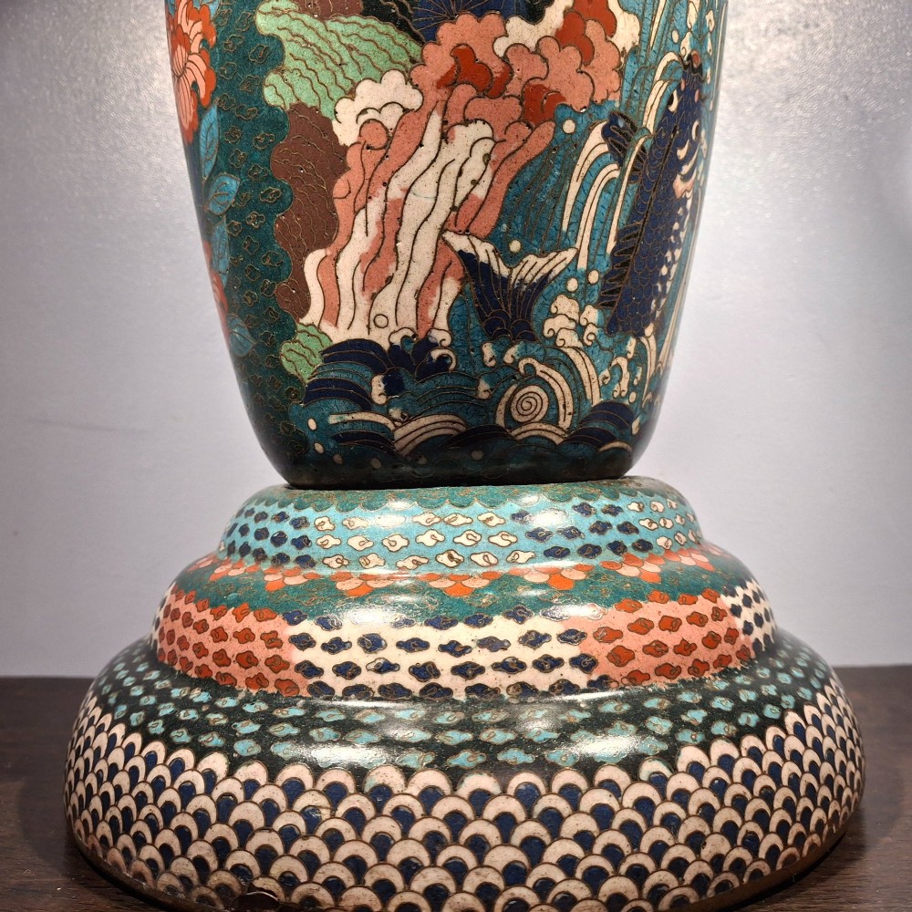 A large Japanese Meiji period cloisonne enamel vase with a wide flared top, decorated with a leaping koi carp motif amongst waterfalls and polychrome geometric patterns. View IX
