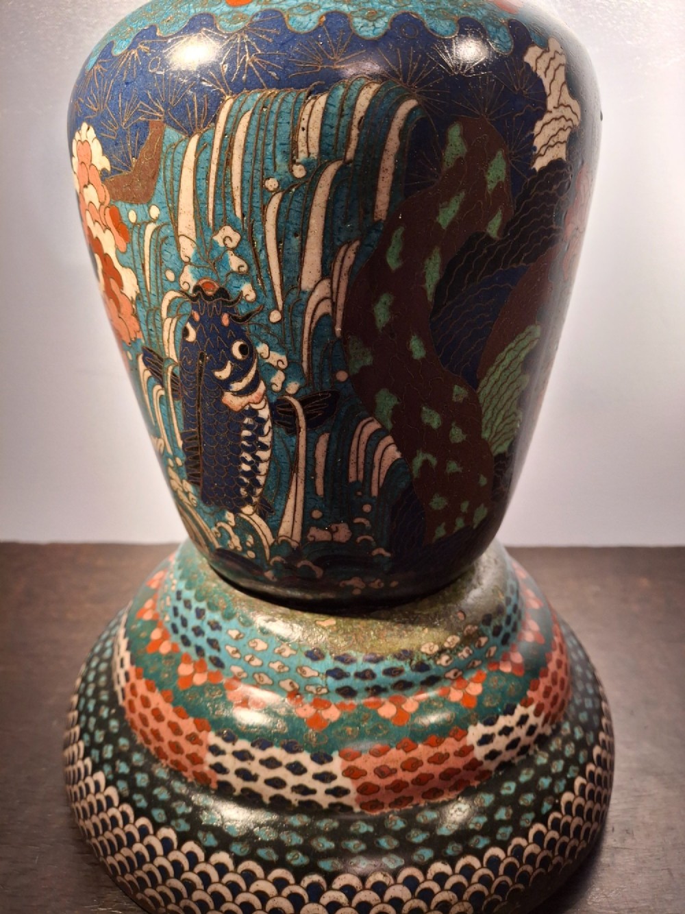 A large Japanese Meiji period cloisonne enamel vase with a wide flared top, decorated with a leaping koi carp motif amongst waterfalls and polychrome geometric patterns. View XIV