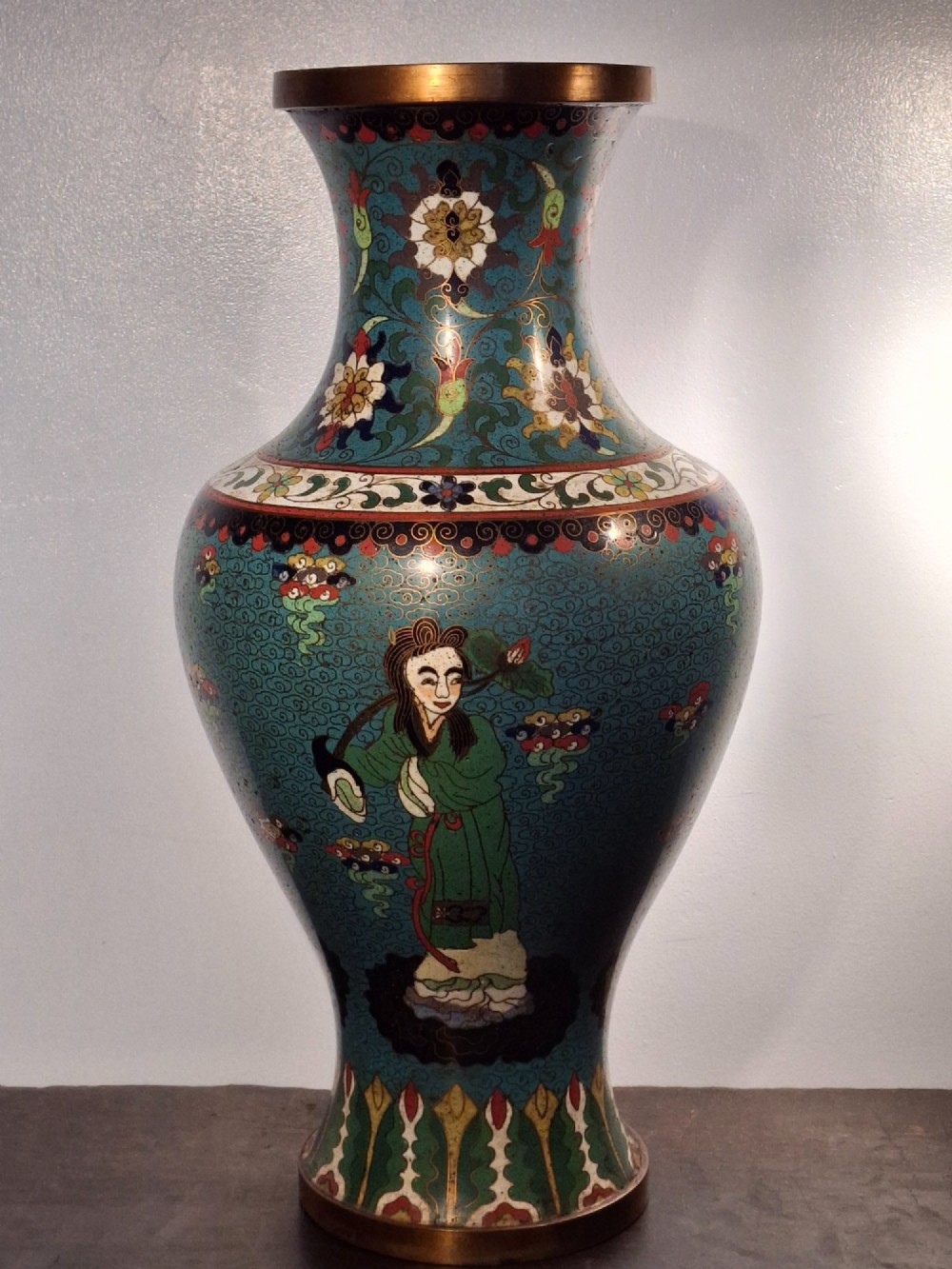 A large Chinese cloisonne enamel baluster vase decorated with scholar figures on a turquoise scrollwork ground with gilded rims. View II