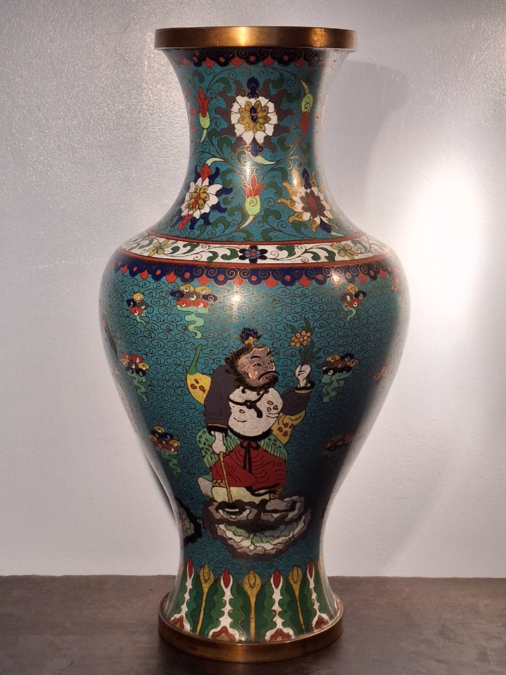 A large Chinese cloisonne enamel baluster vase decorated with scholar figures on a turquoise scrollwork ground with gilded rims. View IV