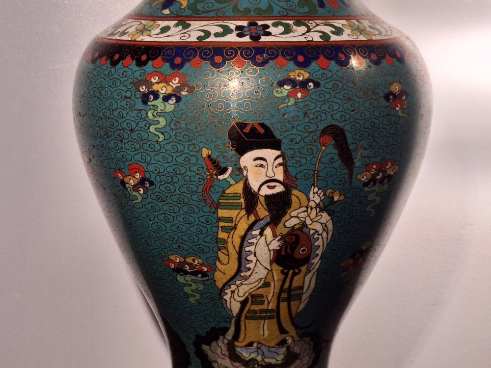 A large Chinese cloisonne enamel baluster vase decorated with scholar figures on a turquoise scrollwork ground with gilded rims. View VII