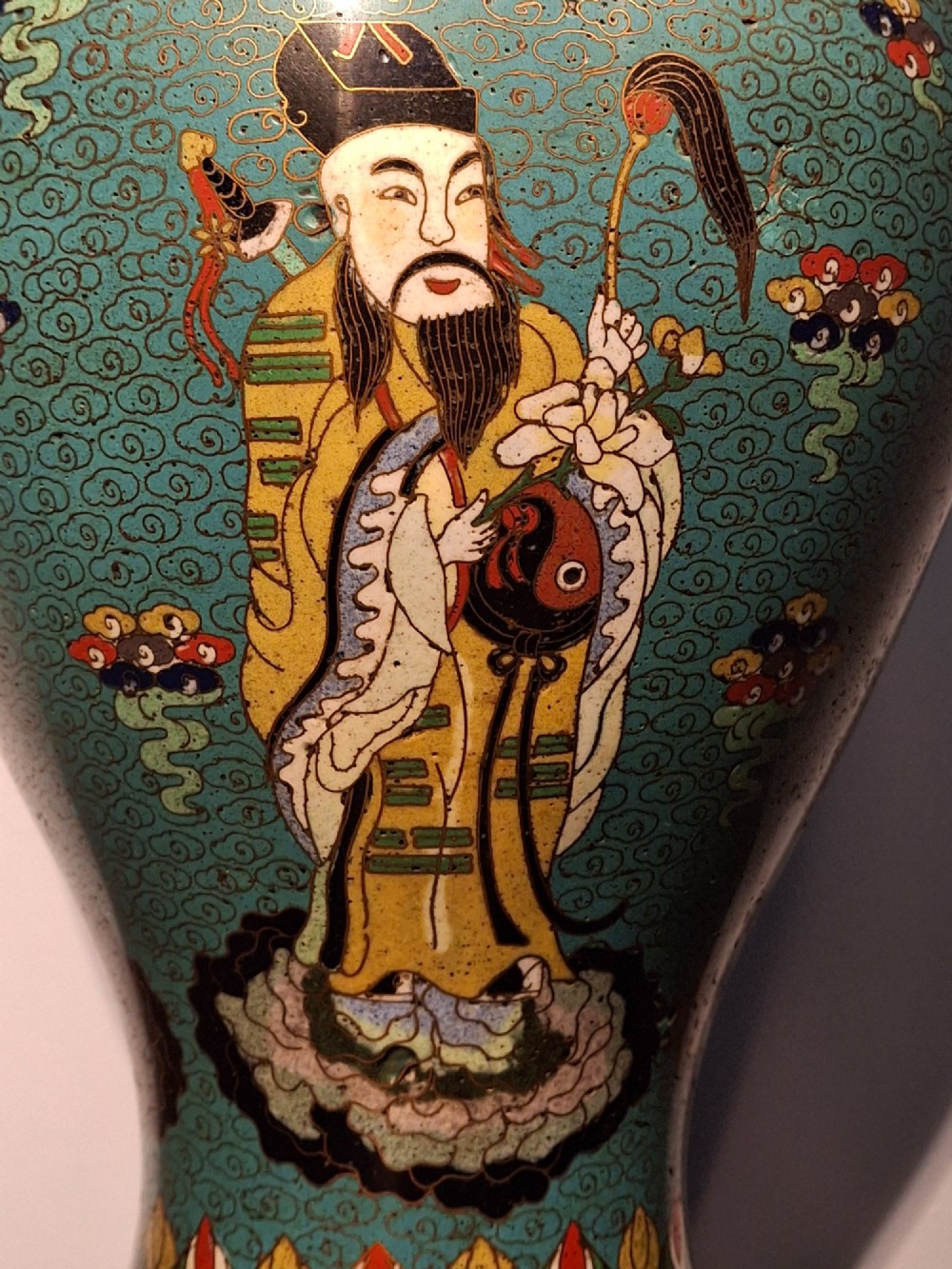 A large Chinese cloisonne enamel baluster vase decorated with scholar figures on a turquoise scrollwork ground with gilded rims. View XI