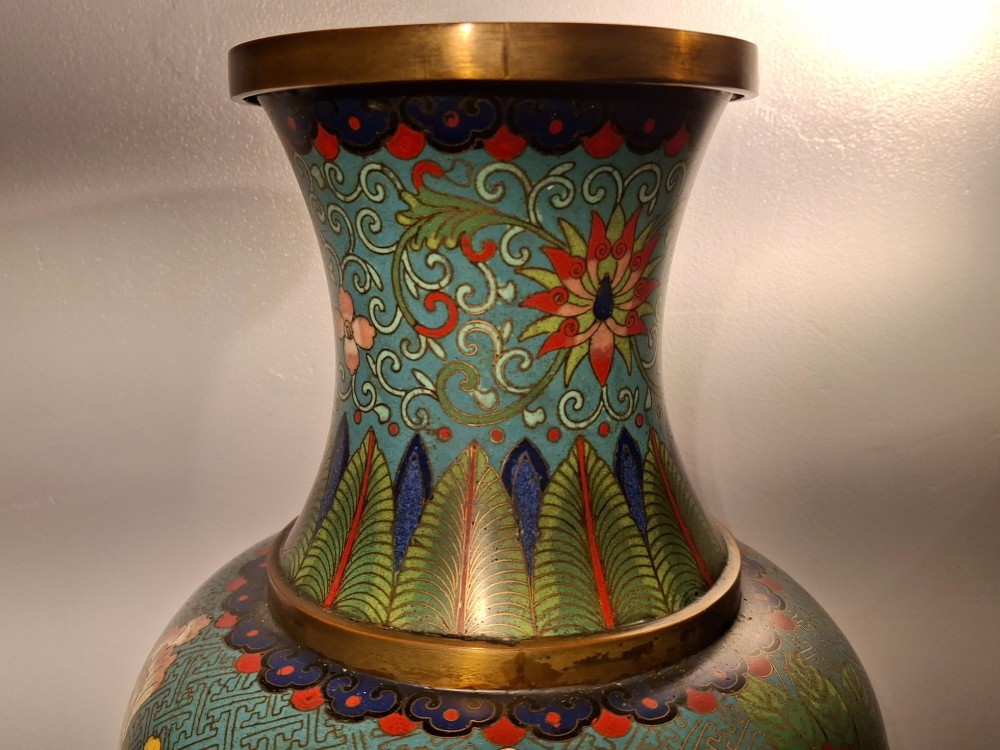 A large Chinese cloisonne enamel vase with pink and yellow floral motifs over a blue geometric ground and brass rim. View IX