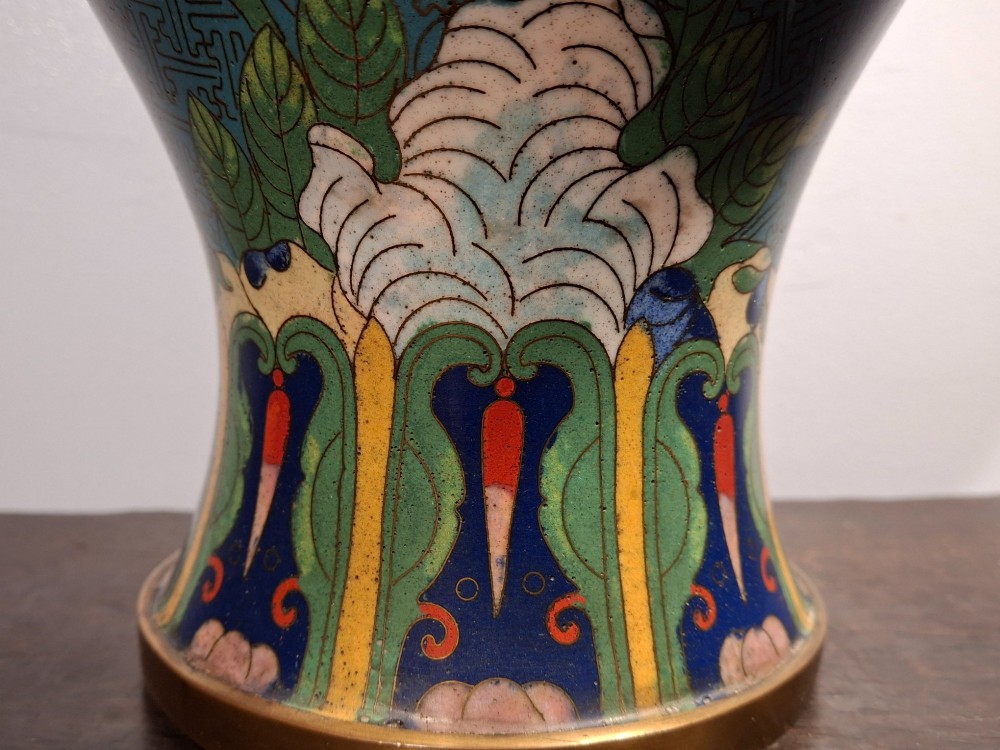 A large Chinese cloisonne enamel vase with pink and yellow floral motifs over a blue geometric ground and brass rim. View XII
