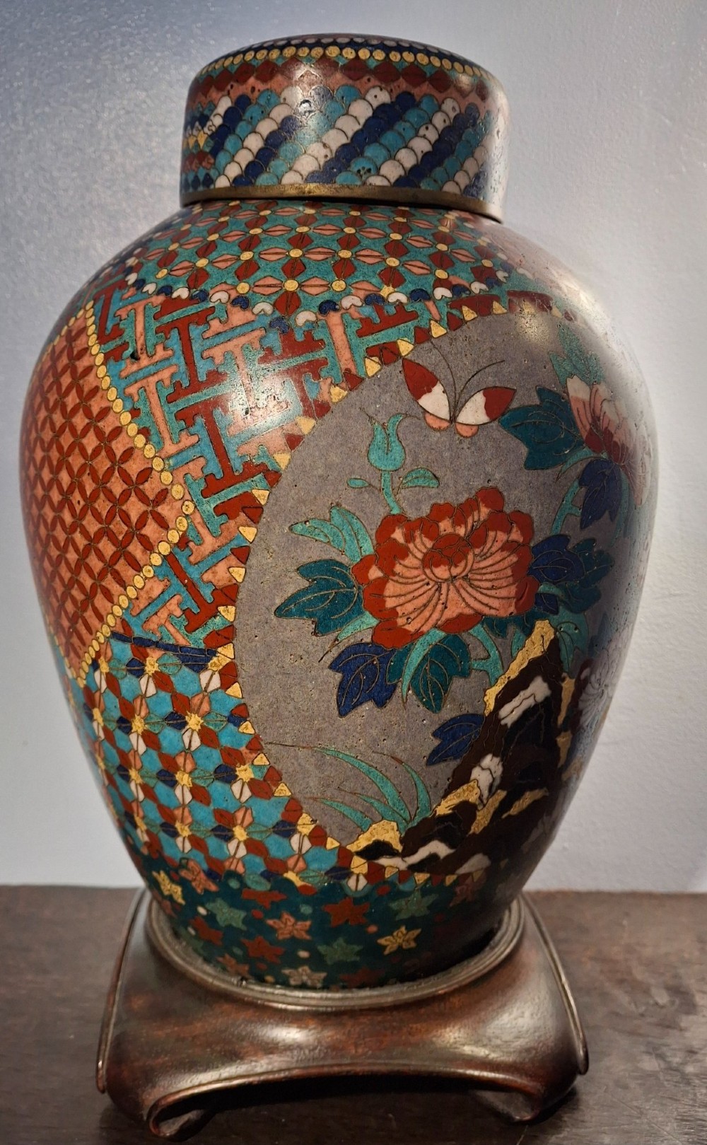A nineteenth-century Japanese cloisonne enamel ginger jar featuring a patterned mosaic design and a colourful bird among floral motifs. View III