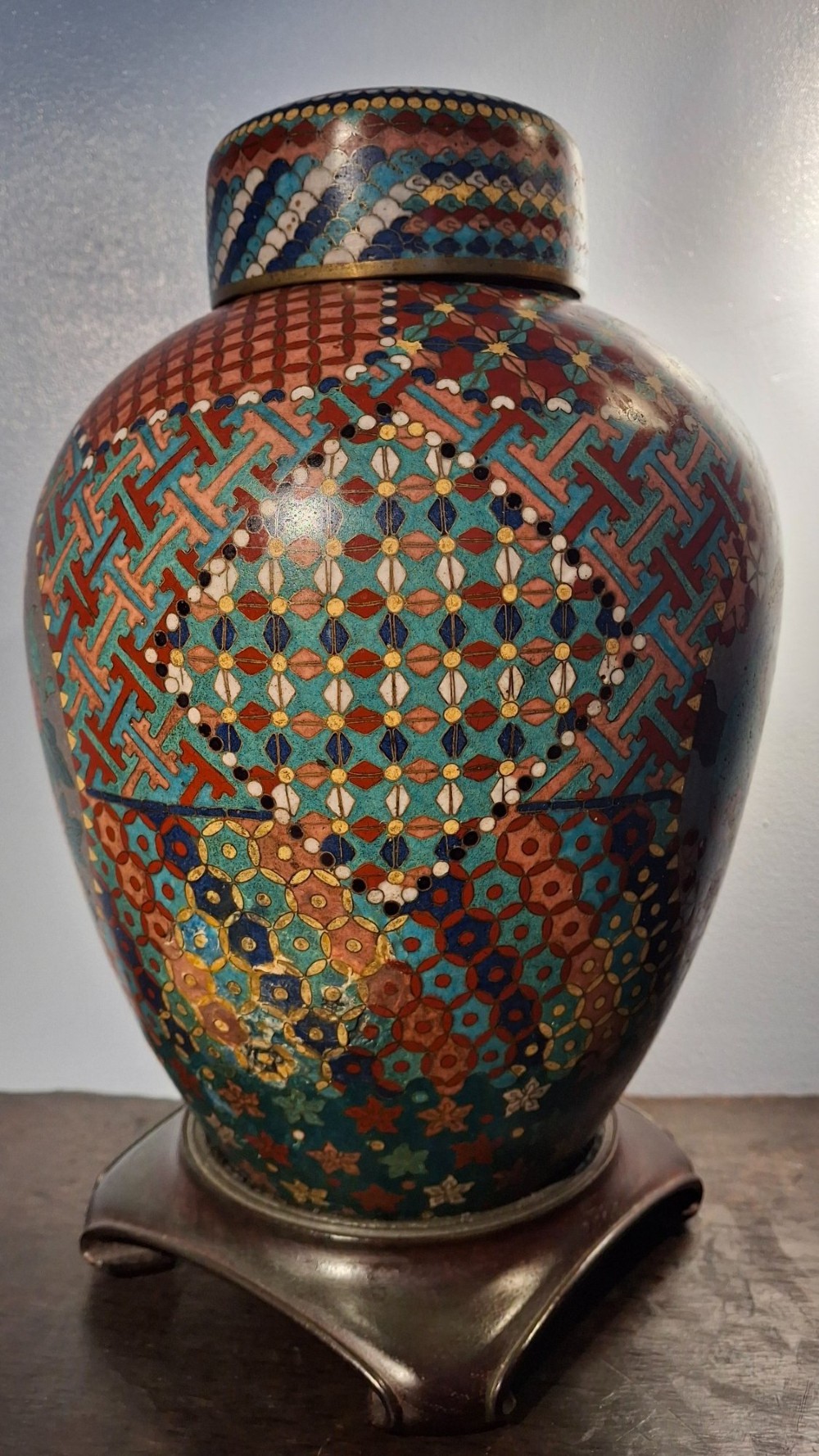 A nineteenth-century Japanese cloisonne enamel ginger jar featuring a patterned mosaic design and a colourful bird among floral motifs. View VI