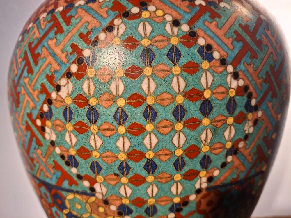 A nineteenth-century Japanese cloisonne enamel ginger jar featuring a patterned mosaic design and a colourful bird among floral motifs. View VIII