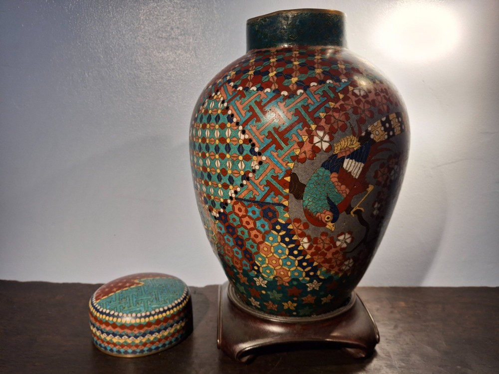 A nineteenth-century Japanese cloisonne enamel ginger jar featuring a patterned mosaic design and a colourful bird among floral motifs. View X