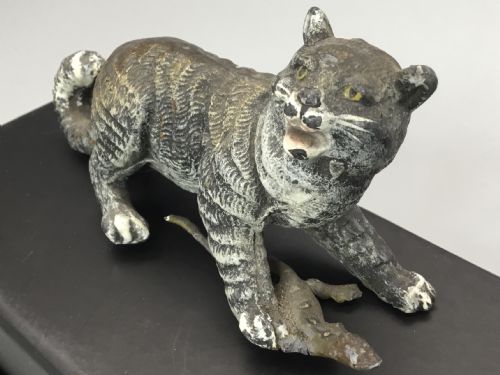 Cold Painted Puma Catching Lizard