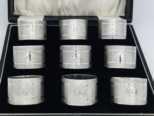 Fabulous Cased Set of 9 Silver Napkin Rings