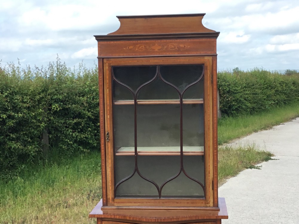 Fine Quality Inlaid display cabinet on serpentine cupboard base View VIII