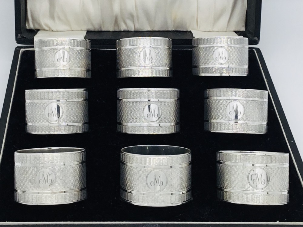 Fabulous Cased Set of 9 Silver Napkin Rings