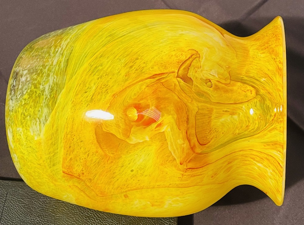 A flared 1930s Gray-Stan art glass vase featuring a swirling yellow and orange mottled pattern. View II
