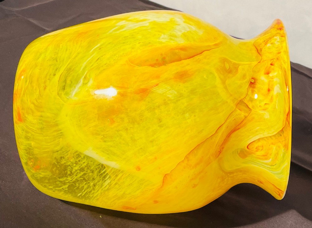 A flared 1930s Gray-Stan art glass vase featuring a swirling yellow and orange mottled pattern. View III