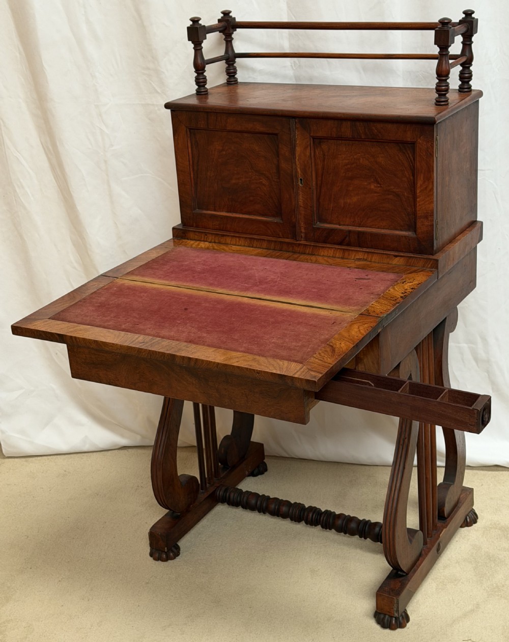 A dark mahogany Regency writing desk featuring twin lyre-shaped end supports, a fold-out leather-lined writing surface, and an upper cabinet with small fitted drawers. View III