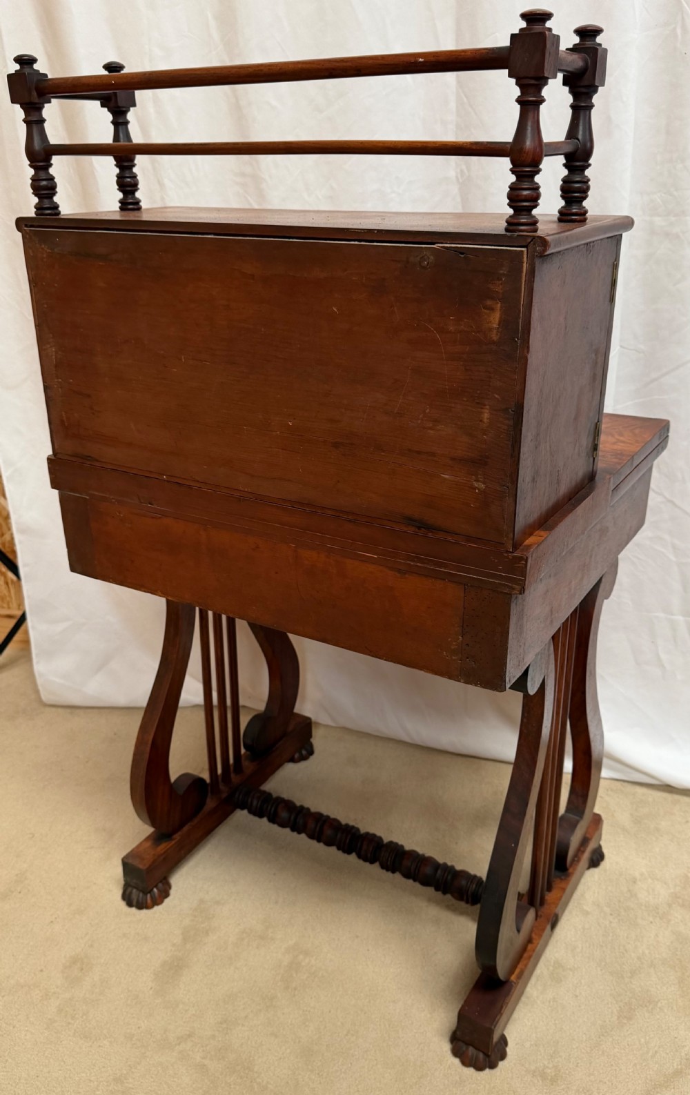 A dark mahogany Regency writing desk featuring twin lyre-shaped end supports, a fold-out leather-lined writing surface, and an upper cabinet with small fitted drawers. View XIII