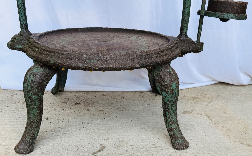 A Victorian patinated green cast iron and forged steel cheese press featuring a threaded screw mechanism, wheel handle, lever arm, chain, counterweight, and tripod legs. View IV
