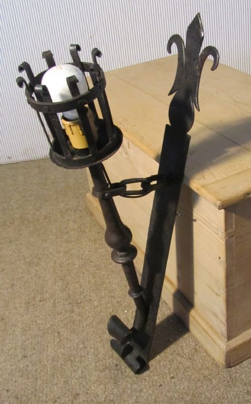 A Superb Pair of French Gothic Iron Wall Lights (Torches)