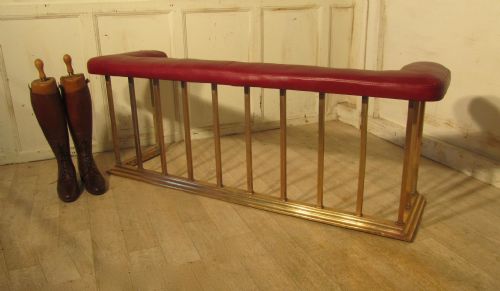 A Large Brass and Leather Club Fender