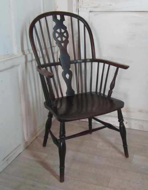 A Georgian Elm and Ash Wheel Back Windsor Carver Chair