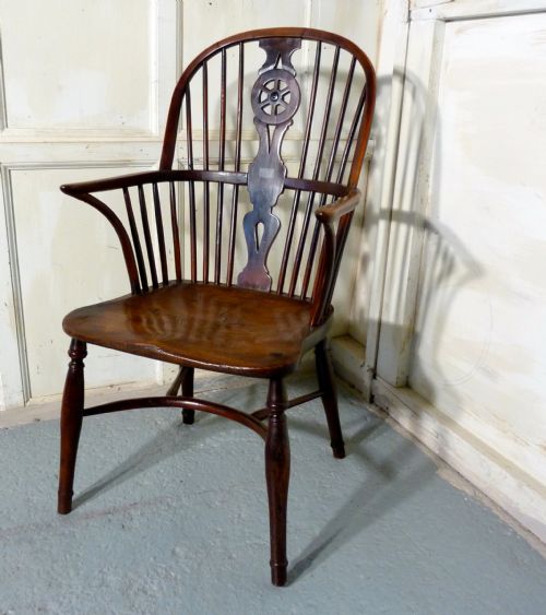 A Georgian Elm and Yew Wheel Back Windsor Carver Chair