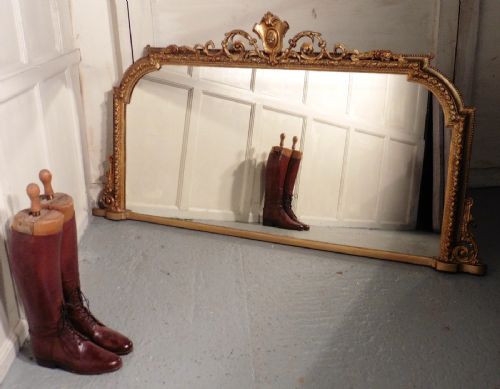 A Large Victorian Gilt Arched Over Mantle Mirror by Adams