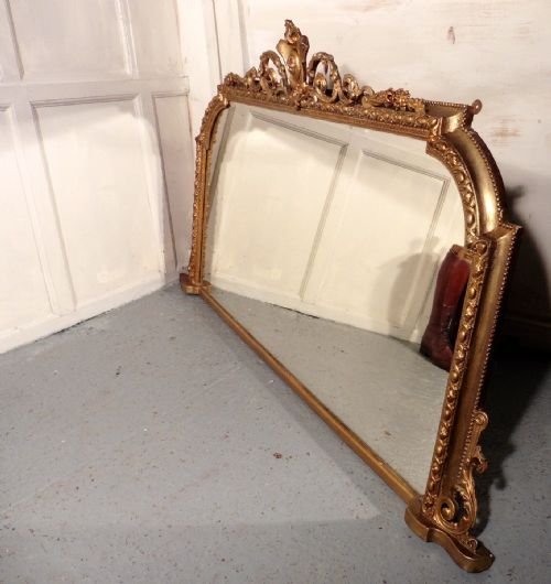 fig 1. A Large Victorian Gilt Arched Over Mantle Mirror by Adams