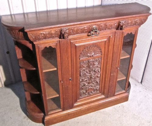 A Gothic Arts and Crafts Carved Golden Oak  Sideboard by Gillows 1870