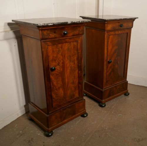 A Pair of Figured Mahogany Bedside Cupboards
