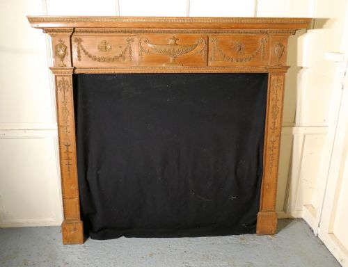 A Large 19th Century Adams Style Stripped Pine Fireplace.