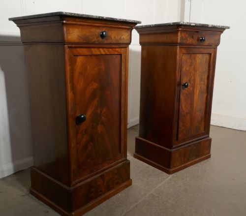 A Pair of Figured Mahogany Bedside Cupboards
