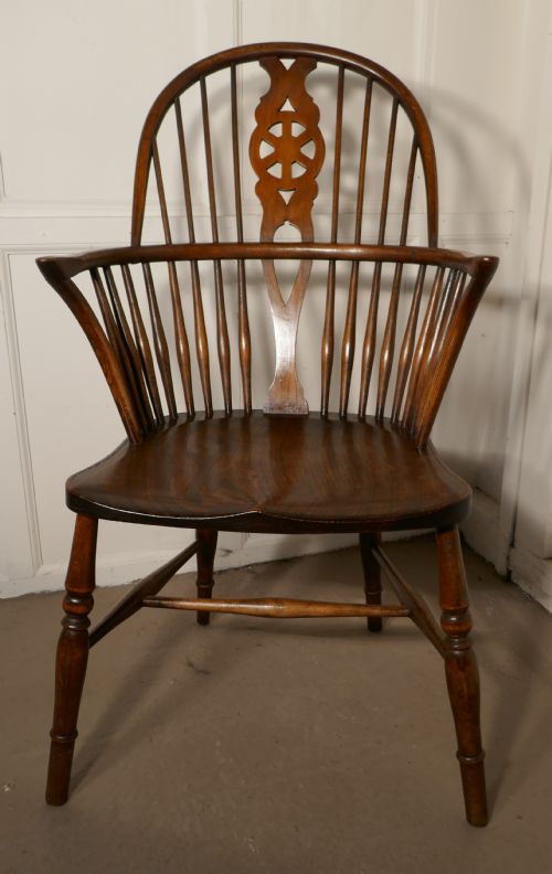 A Georgian Elm and Ash Wheel Back Windsor Carver Chair