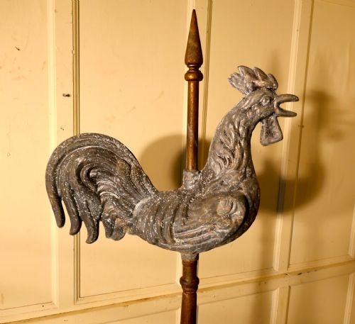 fig 2. Cockerel Weather Vane Mounted on a Tower Roof Finial