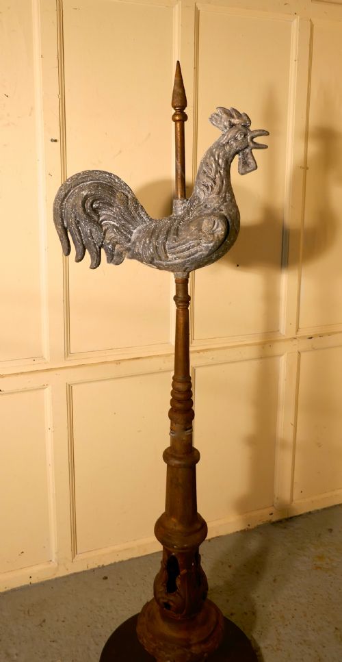 fig 3. Cockerel Weather Vane Mounted on a Tower Roof Finial