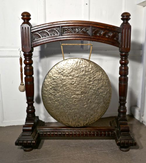 A Large Gothic Carved Oak and Brass Dinner Gong